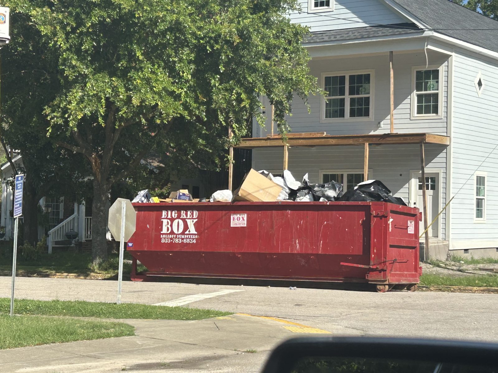 Big Red Box roll-off dumpster on a residential renovation job in Columbia, SC